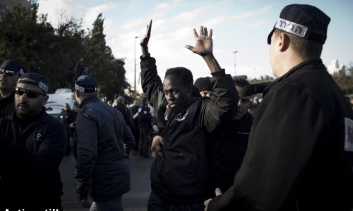 Refugees Freedom march, Jerusalem, 17.12.2013 Israeli immigration officers arrest an African Asylum seeker during a protest outside the Israeli parliamentת following a three days march from the South of Israel on December 17, 2013 in Jerusalem. Over 150 African asylum Seekers abandoned the \\'open\\' Israeli detention center, which opened last week, to march to Jerusalem to protest the Israeli government policy of refusing to recognize their refugee status. Israeli immigration officers arrested all the immigrants who took part in the march, sending them back to jail.