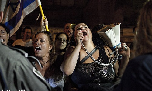 Protest for public housing, Jerusalem, Israel, 26.7.2012 Protesters shout slogans in front of the house of Housing Minister Ariel Atias in Jerusalem, during a protest for public housing on July 26, 2012. Photo by: JC/Activestills.org