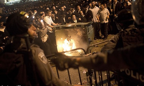 Protest against compulsory military service, West Jerusalem, 16.5.2013 Orthodox Jews clash with police in front of the main army recruitment office in Jerusalem on May 16, 2013, during a demonstration against any govrnment policy obliging them to undergo military service. During clashes, the police arrested 10 protestors. Photo by: Oren Ziv/ Activestills.org