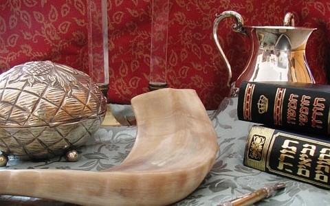 Judaica (clockwise from top): Shabbat candlesticks, handwashing cup, Chumash and Tanakh, Torah pointer, shofar, and etrog box CC: Wikipedia