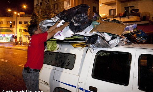 Eviction of the protest tent in south Tel Aviv, 26/72011. Workers of Tel aviv municipality evicted for the 2nd time the protest camp in Levinsky part in South Tel Aviv, confiscating all the tents. Photo by: Oren Ziv/ Activestills.org